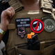 An attendee wears a “Three Percenter” patch during a Proud Boys rally at Delta Park in Portland, Oregon